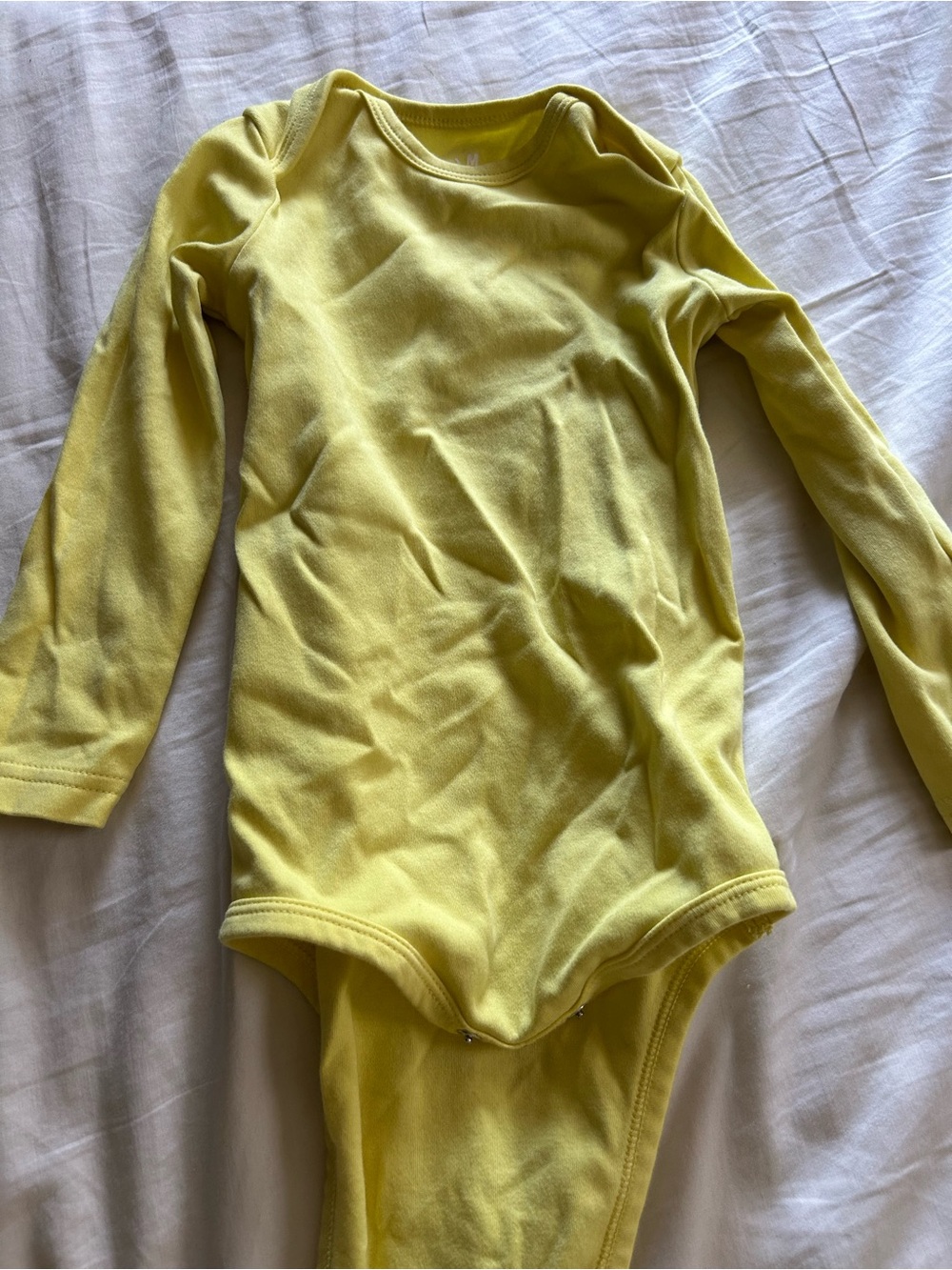 Kids Long-Sleeve One-Piece Bodysuit in Yellow - cotton. Primary. 18-24 months.